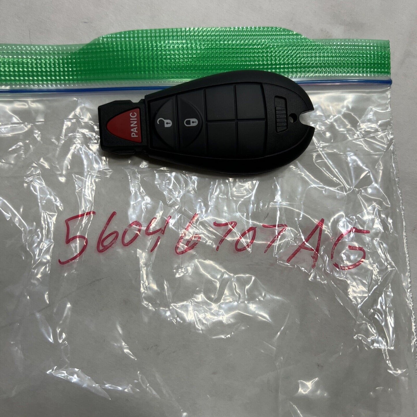 New OEM Genuine Mopar Grand Caravan Integrated Key Fob Transmitter 56046707AG